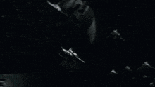 a black and white photo of a fighter jet with the number 10 on the side