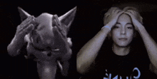 a black and white photo of a cat and a man covering his face .