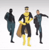 a group of three men in superhero costumes are dancing together .