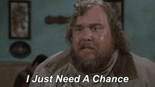 a man with a beard has the words i just need a chance on his face