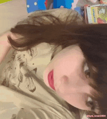 a close up of a woman 's face with the name kyli_lover2004 on the bottom right corner