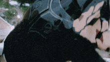 a close up of a person 's face with a black helmet
