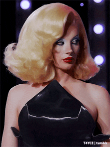 a woman with blonde hair and red lips is wearing a black dress with t4yce tumblr written on the bottom