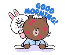 a brown bear and a white rabbit are sitting on a bed and the rabbit is kissing the bear on the forehead .