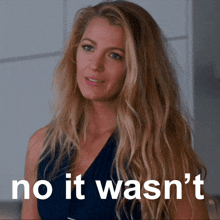 a woman with long blonde hair has the words no it wasn 't on her face