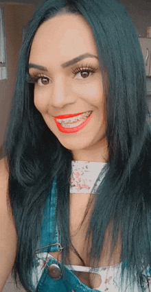 a woman with braces on her teeth is smiling