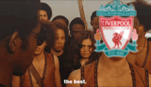 a group of people with a liverpool football club logo on their face