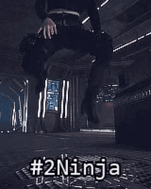 a person is standing in a room with the words # 2ninja written on the ground