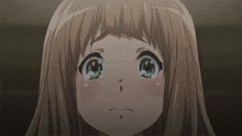 a close up of a girl 's face with tears running down her cheeks