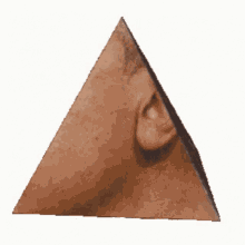 it looks like a pyramid with a person 's face on it .