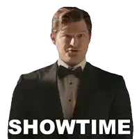 a man in a tuxedo and bow tie says showtime in white letters