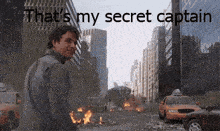 a man standing in front of a city with the words that 's my secret captain on the bottom