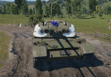 a tank with a blue hat on top of it