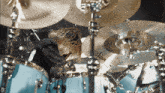 a person playing a drum set with a cymbal that says zildjian