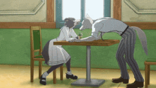 a man and a woman are sitting at a table and the woman is licking the man 's face