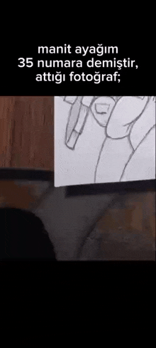 a person is drawing a picture of a person 's hand with a pen .