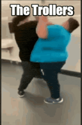 a gif of two people fighting with the words the trollers above them