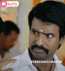 a man with a mustache has the words starttamilchat.in on the bottom right
