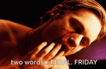 a man with blood on his face and the words " two words feral friday "