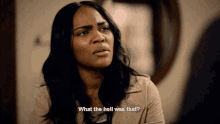 a woman says " what the hell was that " in front of a mirror
