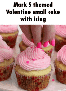mark s themed valentine small cake with icing is being decorated with pink frosting