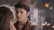 a man and a woman are looking at each other in a sony sab ad