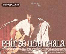 a man is singing into a microphone while playing a guitar in front of a poster that says har