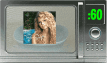 a microwave with a picture of taylor swift and the time of .60