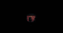 a blurred image of a street with a cross and the letter k