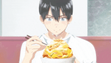 a man with chopsticks is eating a large bowl of food