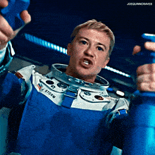 a man in a space suit with the word storm on the front