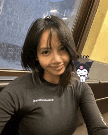 a girl wearing a black shirt with the name lisa on the front