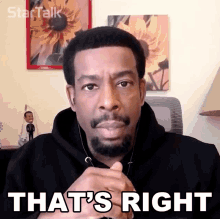 a man with a beard and ear buds says that 's right