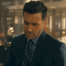 a man in a suit and tie with saint-pierre written on the bottom right