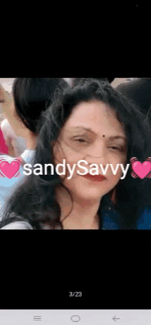 a close up of a woman 's face with the words sandysavvy written on it .