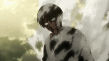 a man in a white shirt is covered in black and white smoke