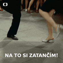 a man and a woman are dancing with the words na to si zatančim in the corner