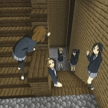 a group of anime girls are standing next to each other on a set of stairs .