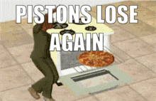 a man is standing in front of a stove with a pizza in it and the words pistons lose again
