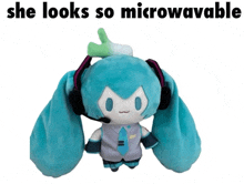 a stuffed hatsune miku doll with headphones and a green onion on her head says she looks so microwavable