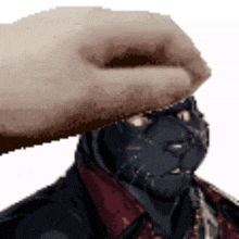 a pixelated image of a person petting a black cat