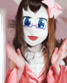 a woman wearing a mask with glasses and a pink bow on her head