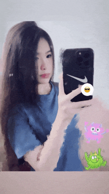 a woman is taking a selfie with a nike phone