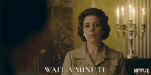 a netflix ad shows a woman with a pearl necklace and the words wait a minute