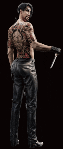 a man with a lot of tattoos on his back is holding a knife