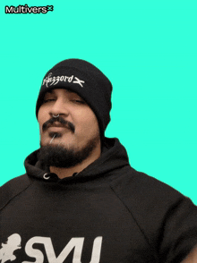 a man with a beard wearing a beanie that says " blizzard " on it
