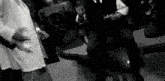 a group of people are standing next to each other in a room .