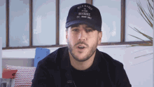 a man wearing a hat that says wild & free