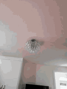 a white wall with a light on it