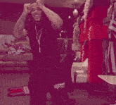 a man is dancing in front of a g fuel sign